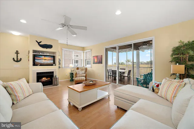 a kitchen with kitchen island granite countertop a sink a counter top space and cabinets