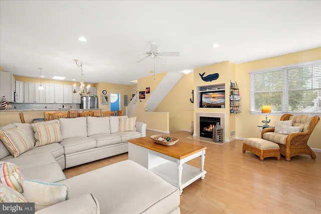 a large kitchen with kitchen island a sink a counter top space and stainless steel appliances