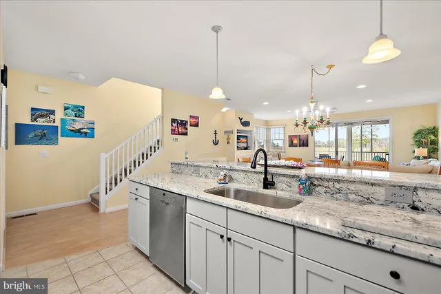 a bedroom with a bed next to a window