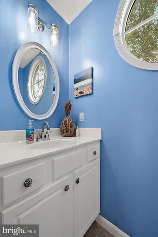 a bathroom with a tub a potted plant and a shower