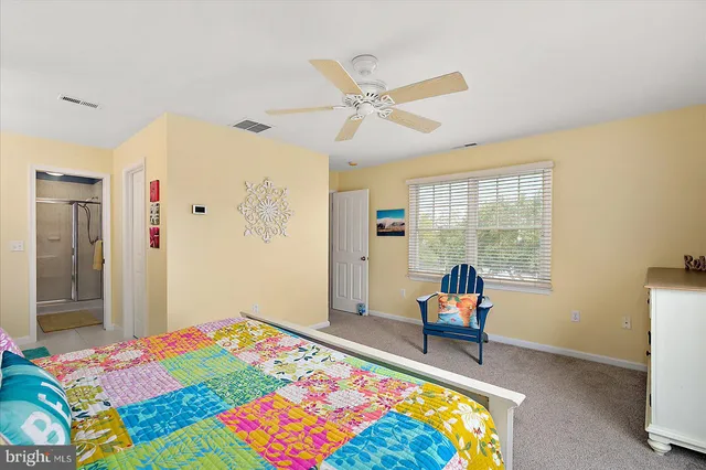 a bedroom with furniture and a chandelier