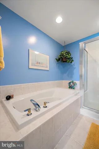a view of a patio with a table and chairs under an umbrella