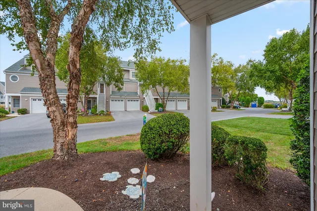 a living room with furniture kitchen view and a fireplace