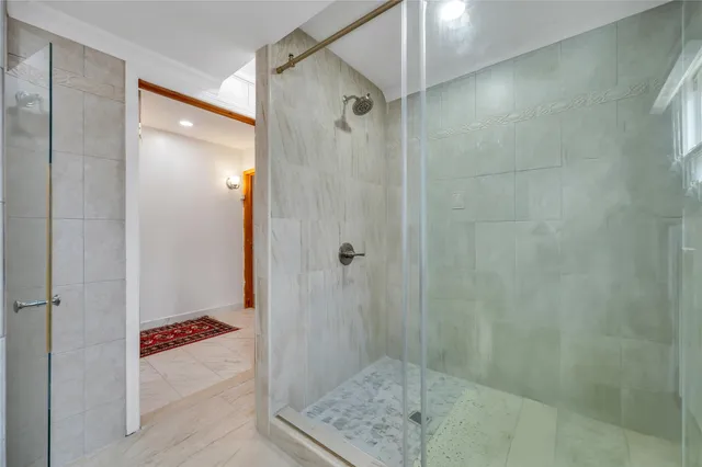 a bathroom with a shower and a sink