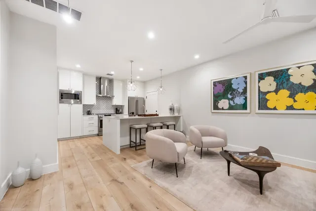 a living room with furniture and a rug