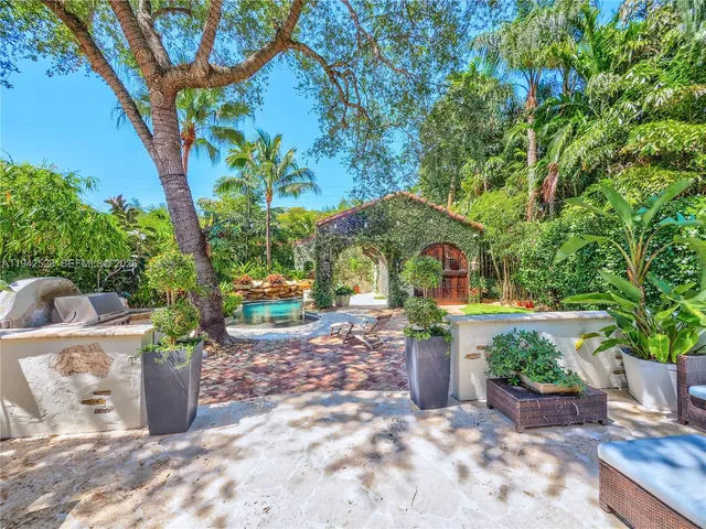 a view of a hallway with seating area