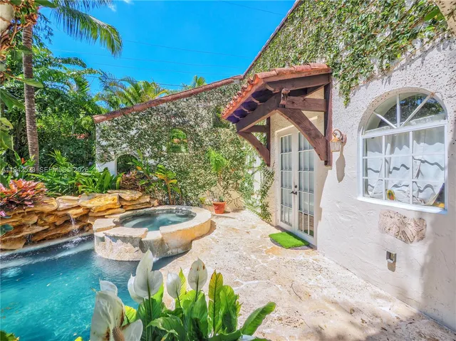 a living room with a couch and a fireplace
