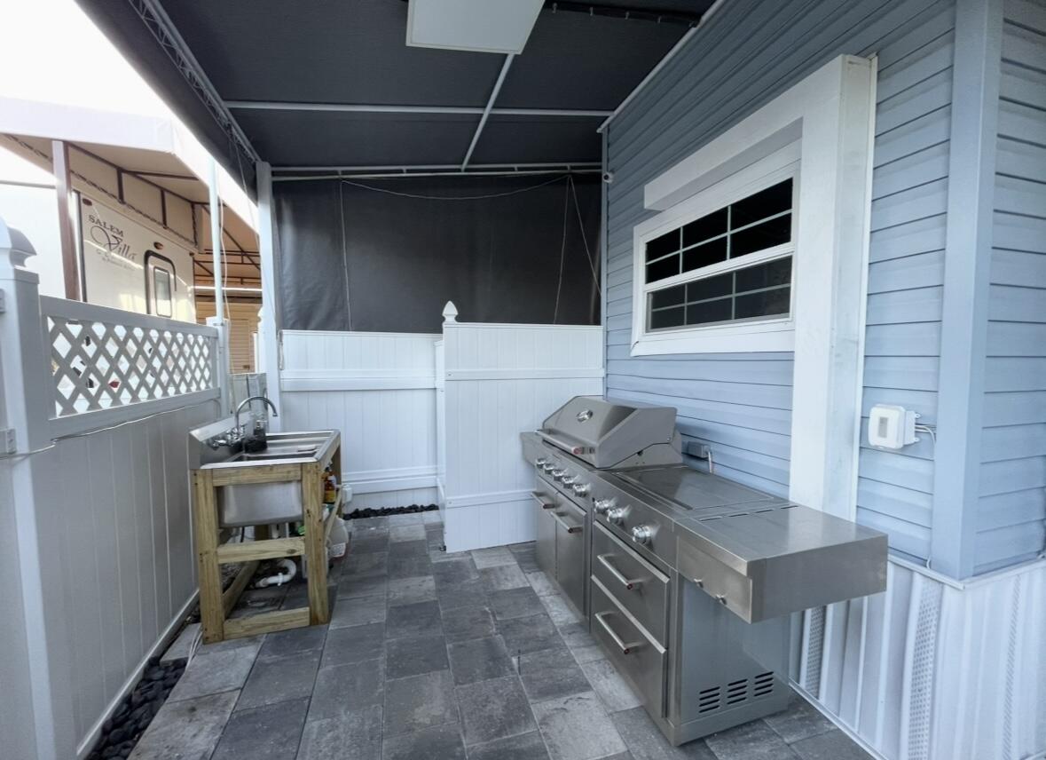 325 Calusa Street, Unit 55 Key Largo, FL 33037 - Photo 3 of 29 a kitchen with a stove and a refrigerator