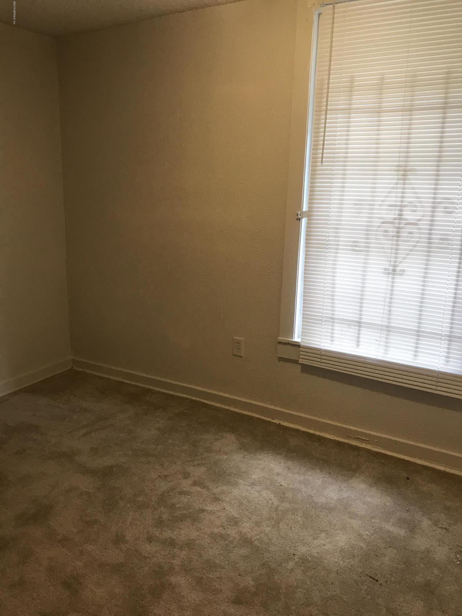 5606 Moncrief Road Jacksonville, FL 32209 - Photo 11 of 26 a view of an empty room and window
