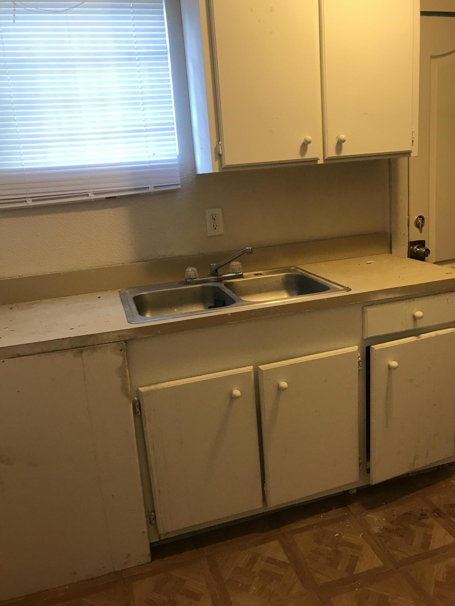 5606 Moncrief Road Jacksonville, FL 32209 - Photo 12 of 26 a close up of a utility room with washer and dryer