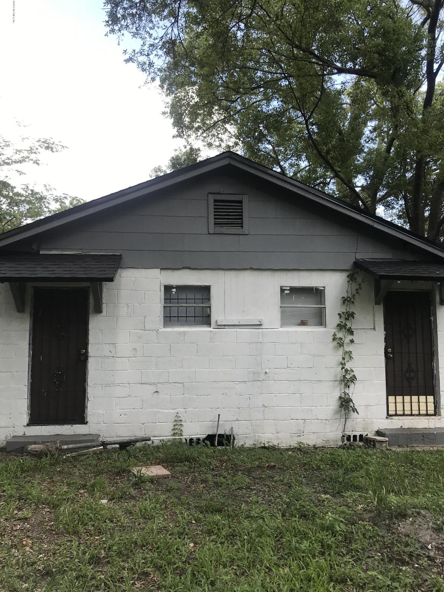 5606 Moncrief Road Jacksonville, FL 32209 - Photo 4 of 26 a front view of a house with a garden