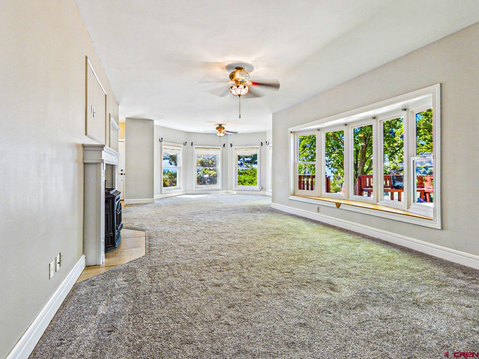 16331 2550th Road Cedaredge, CO 81413 - Photo 14 of 45 wooden floor in an empty room with a window