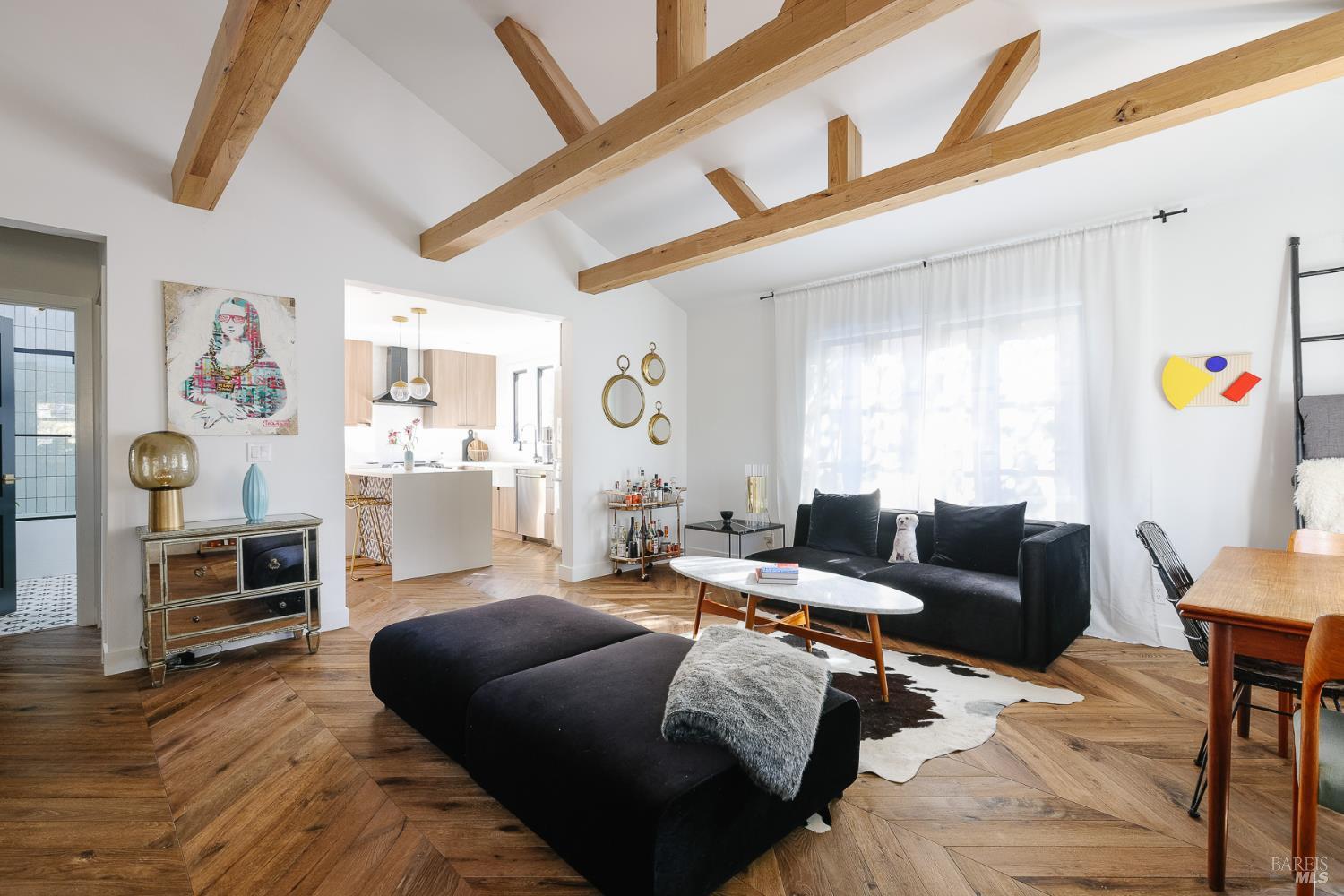 a living room with furniture a flat screen tv and a window