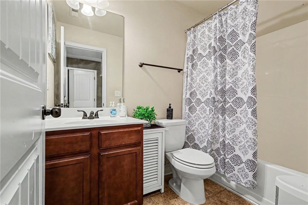 2780 Lakeview Walk Decatur, GA 30035 - Photo 24 of 37 a bathroom with a toilet a sink and a mirror