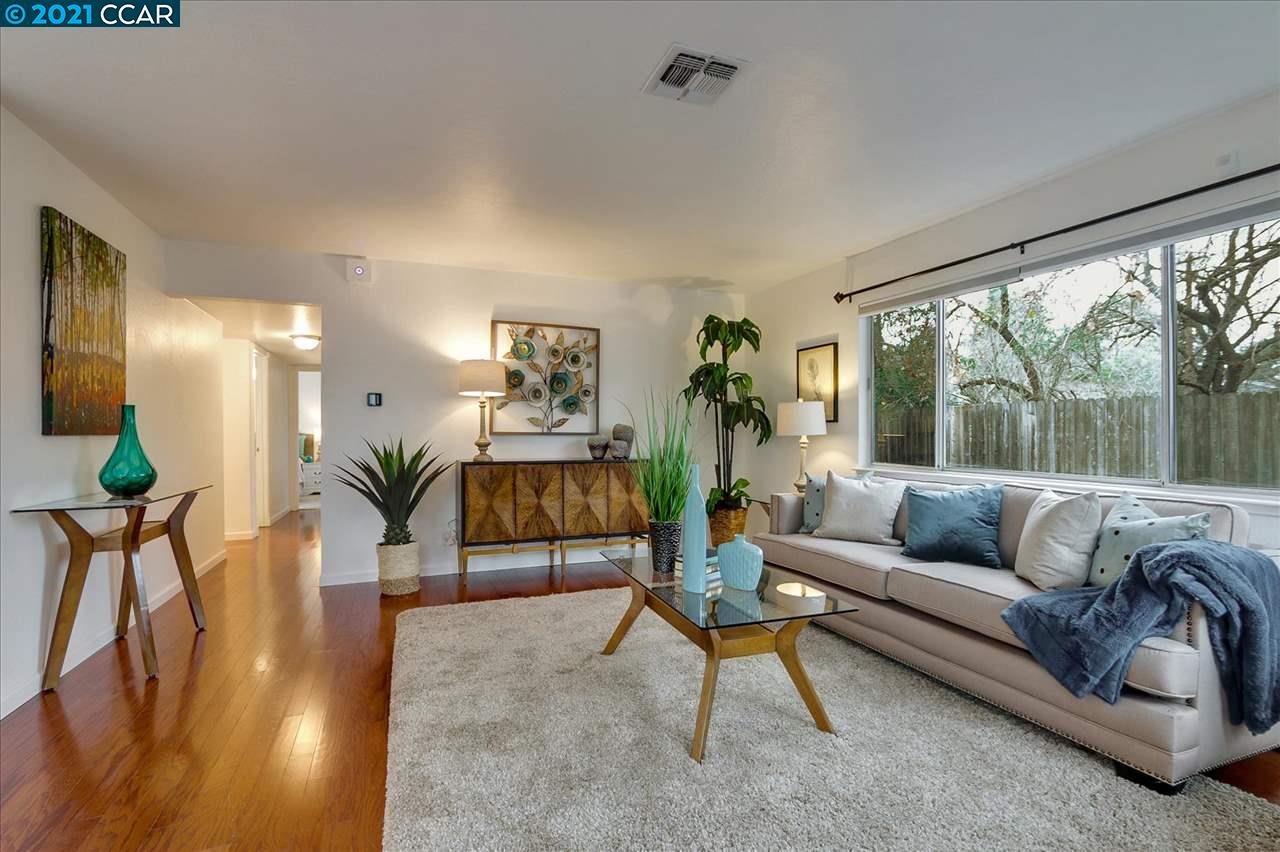 1205 Cape Cod Way Concord, CA 94521 - Photo 1 of 1 a living room with furniture and a large window