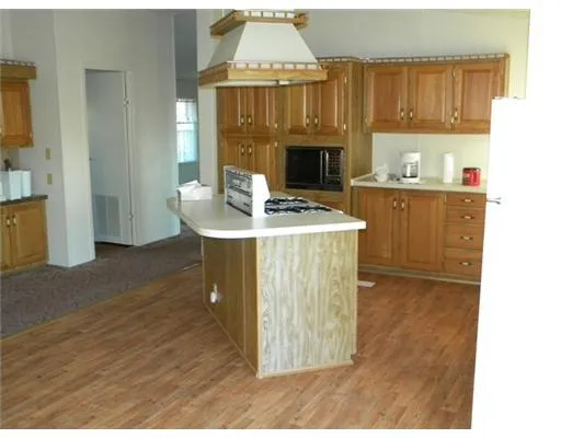 a view of kitchen with wooden floor