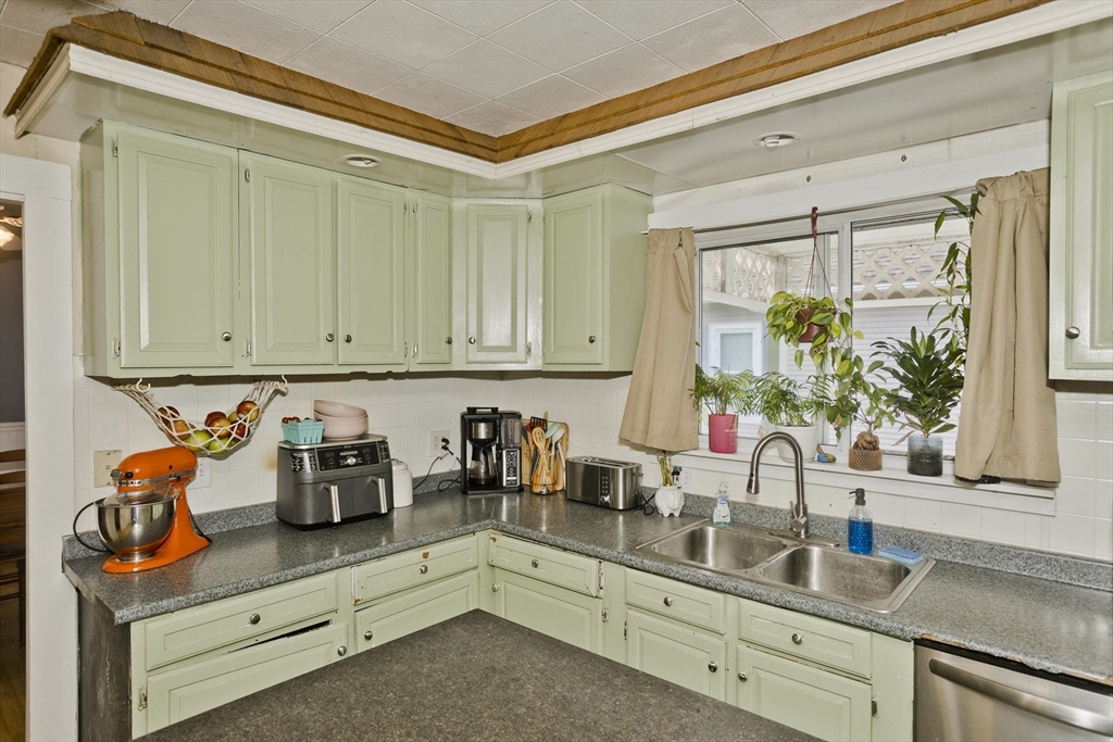 80 Stewart Street Chicopee, MA 01020 - Photo 13 of 37 a kitchen with stainless steel appliances granite countertop a sink and cabinets