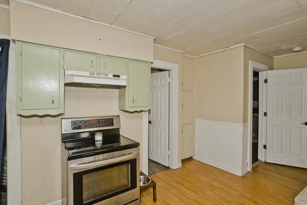 80 Stewart Street Chicopee, MA 01020 - Photo 16 of 37 a kitchen with a stove and a refrigerator