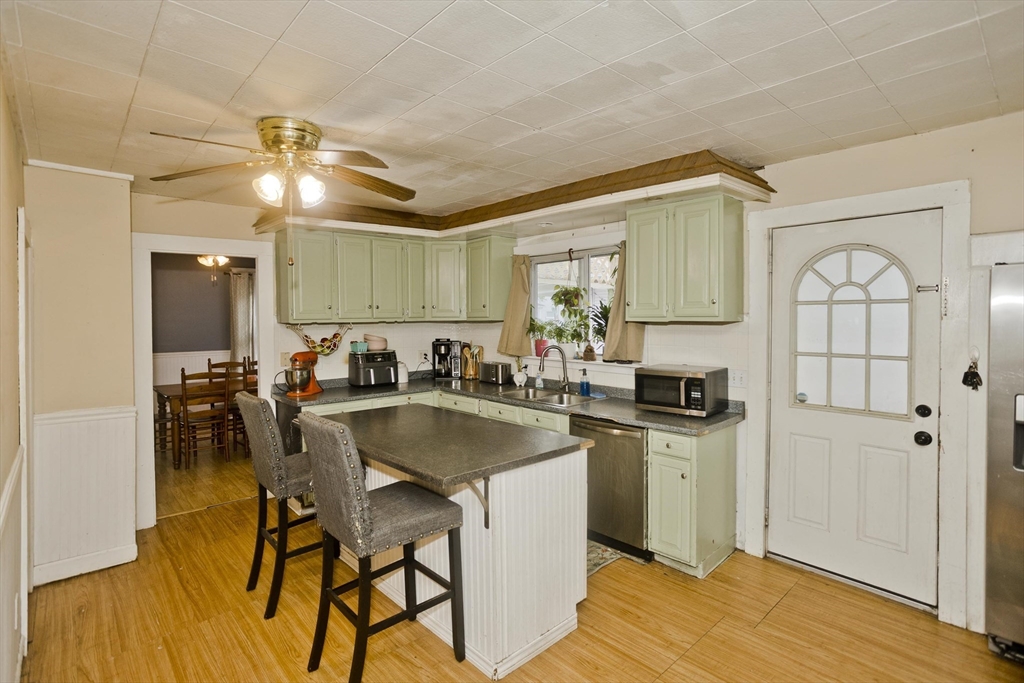 80 Stewart Street Chicopee, MA 01020 - Photo 19 of 37 a kitchen with stainless steel appliances granite countertop a sink a stove and refrigerator