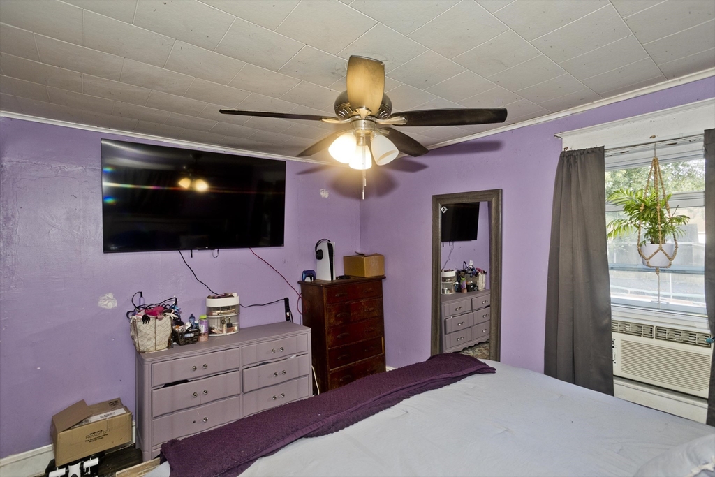 80 Stewart Street Chicopee, MA 01020 - Photo 25 of 37 a bedroom with a bed and a flat screen tv