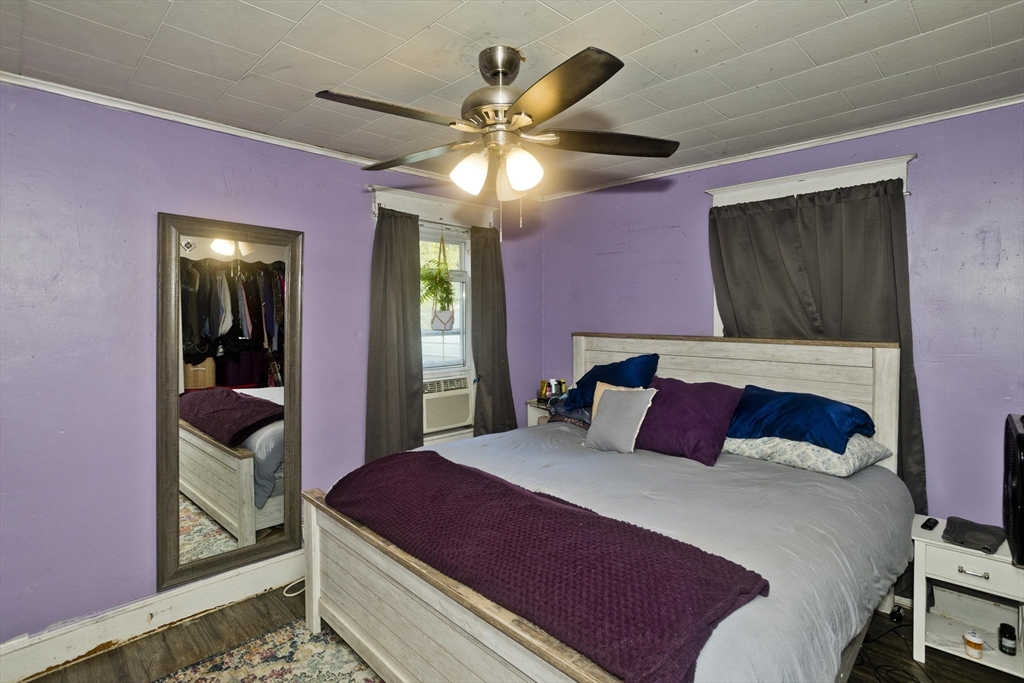 80 Stewart Street Chicopee, MA 01020 - Photo 27 of 37 a bedroom with a bed and a mirror