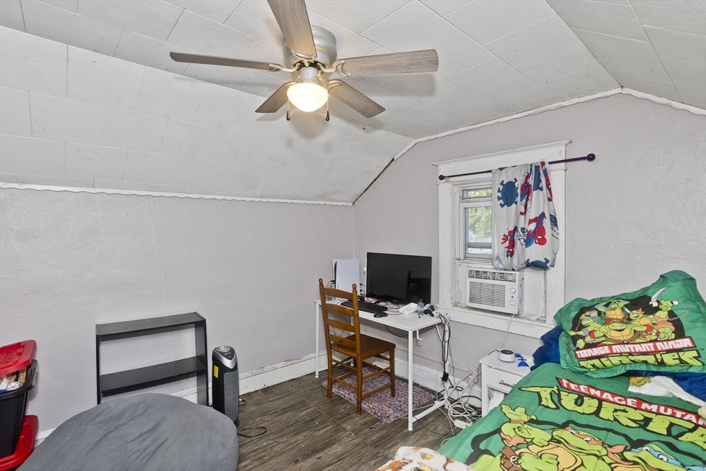 80 Stewart Street Chicopee, MA 01020 - Photo 29 of 37 a view of a workspace with furniture and a flat screen tv