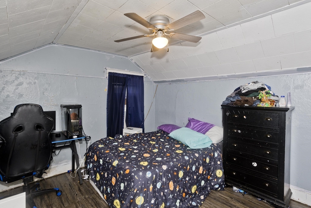 80 Stewart Street Chicopee, MA 01020 - Photo 33 of 37 a bedroom with a bed and wooden floor