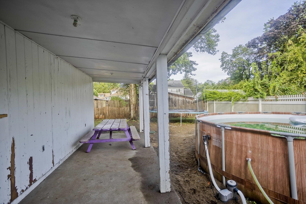 80 Stewart Street Chicopee, MA 01020 - Photo 34 of 37 a view of a porch with furniture and front door