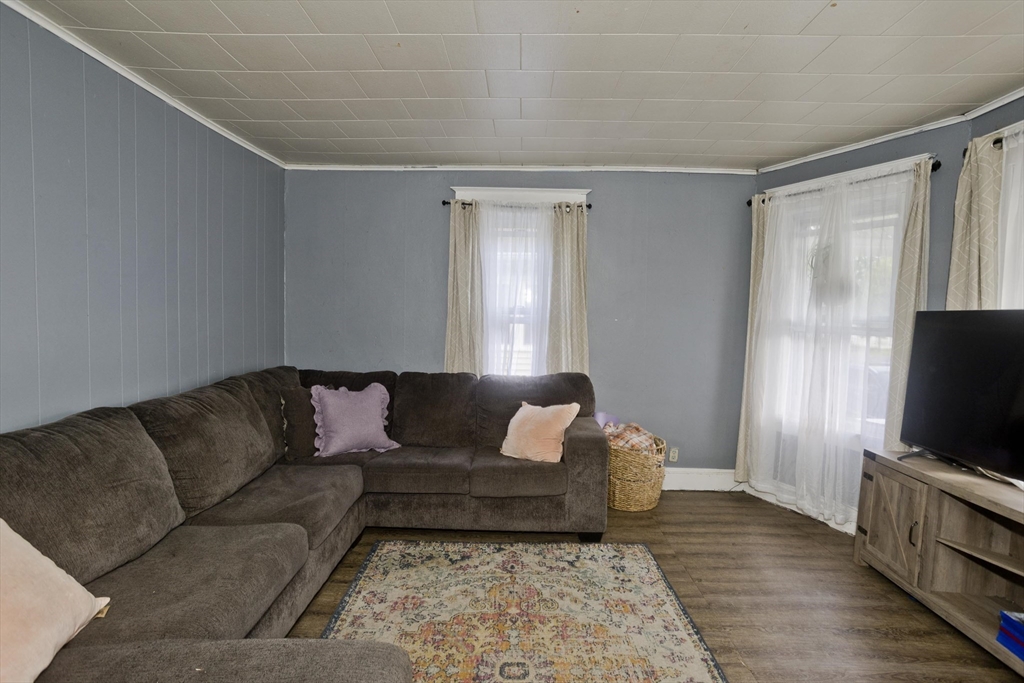 80 Stewart Street Chicopee, MA 01020 - Photo 9 of 37 a living room with furniture and a flat screen tv