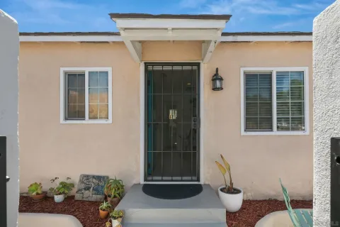 a front view of a house with outdoor seating