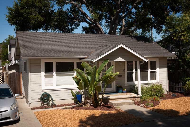 705 Oak Drive Capitola, CA 95010 - Photo 2 of 17 a view of a house with a yard and potted plants