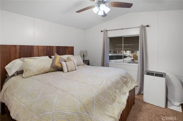 a large white bed in a white room