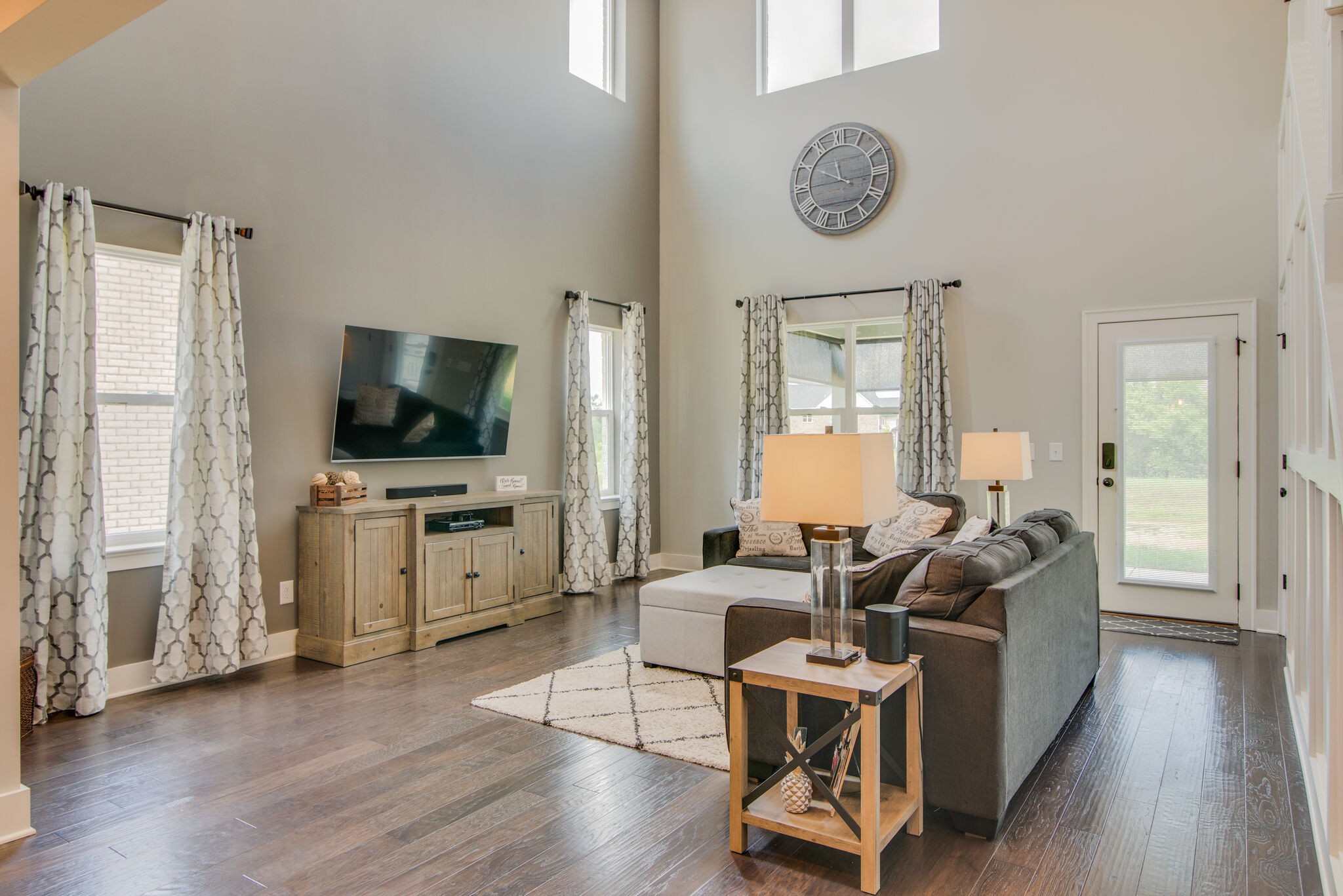 780 Plowson Road Mount Juliet, TN 37122 - Photo 13 of 41 a living room with furniture a flat screen tv and a window