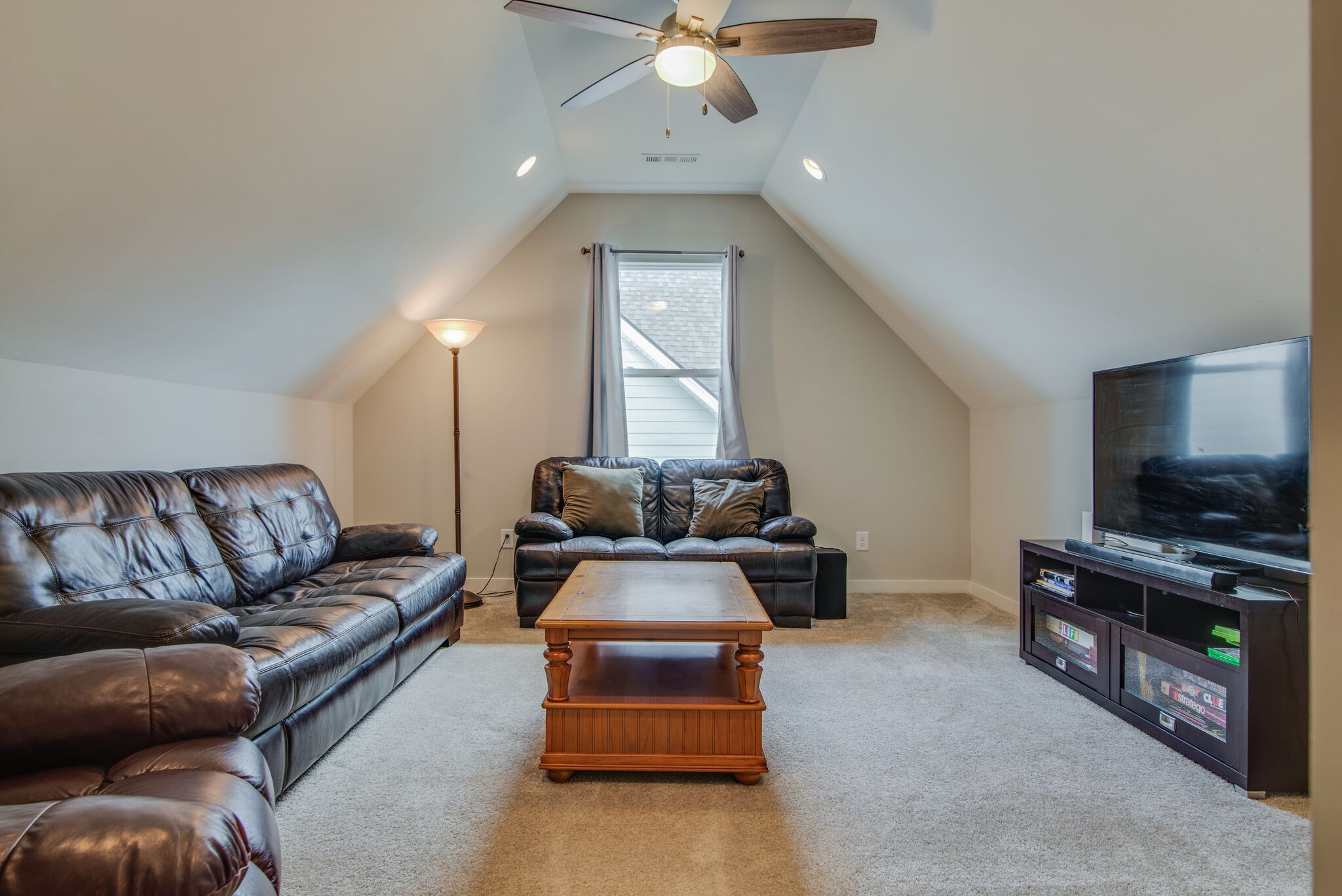 780 Plowson Road Mount Juliet, TN 37122 - Photo 30 of 41 a living room with furniture and a flat screen tv