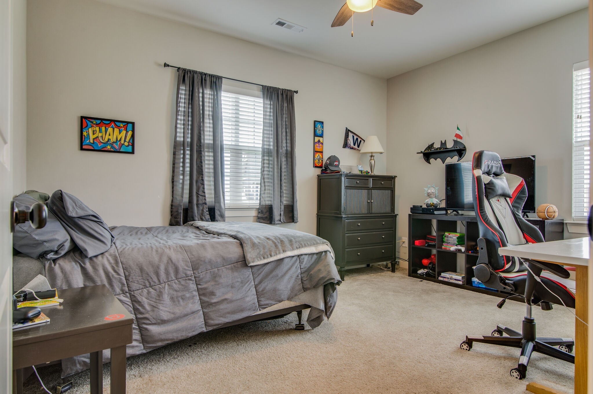 780 Plowson Road Mount Juliet, TN 37122 - Photo 35 of 41 a bedroom with bed a desk and a chandelier