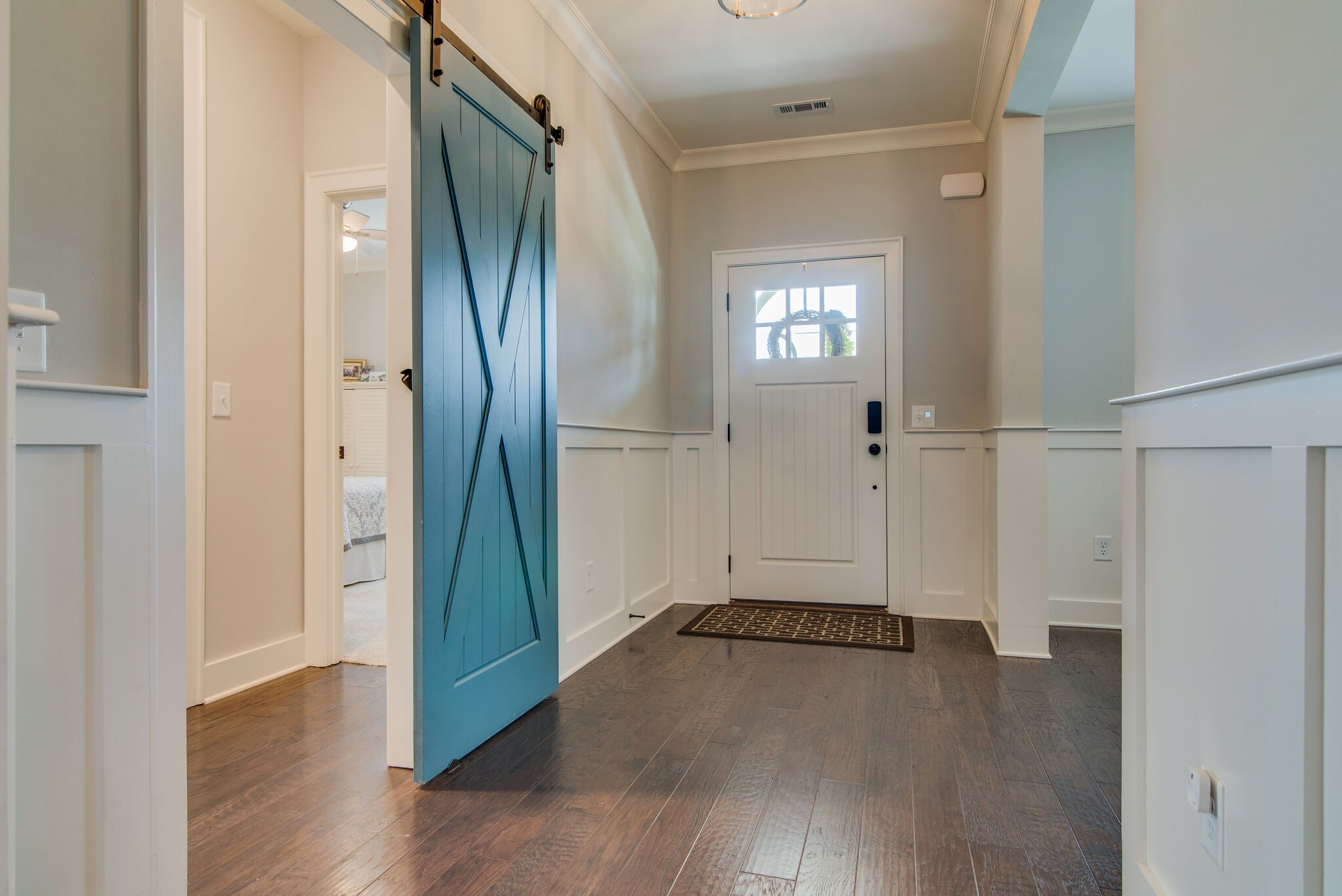 780 Plowson Road Mount Juliet, TN 37122 - Photo 5 of 41 an empty room with wooden floor and a bathroom