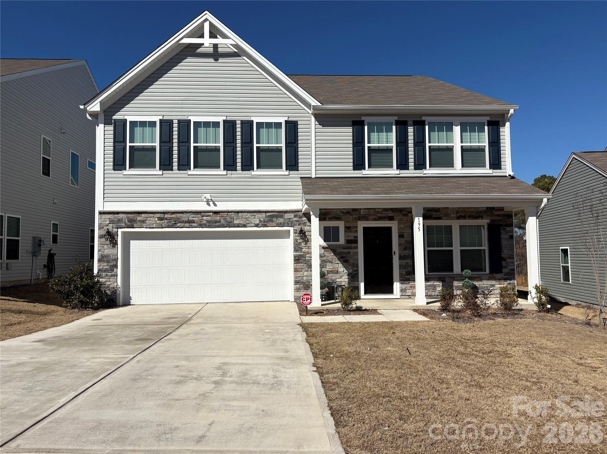 195 Batten Rdg Drive Statesville, NC 28677 - Photo 1 of 34 a front view of a house with glass windows and a yard