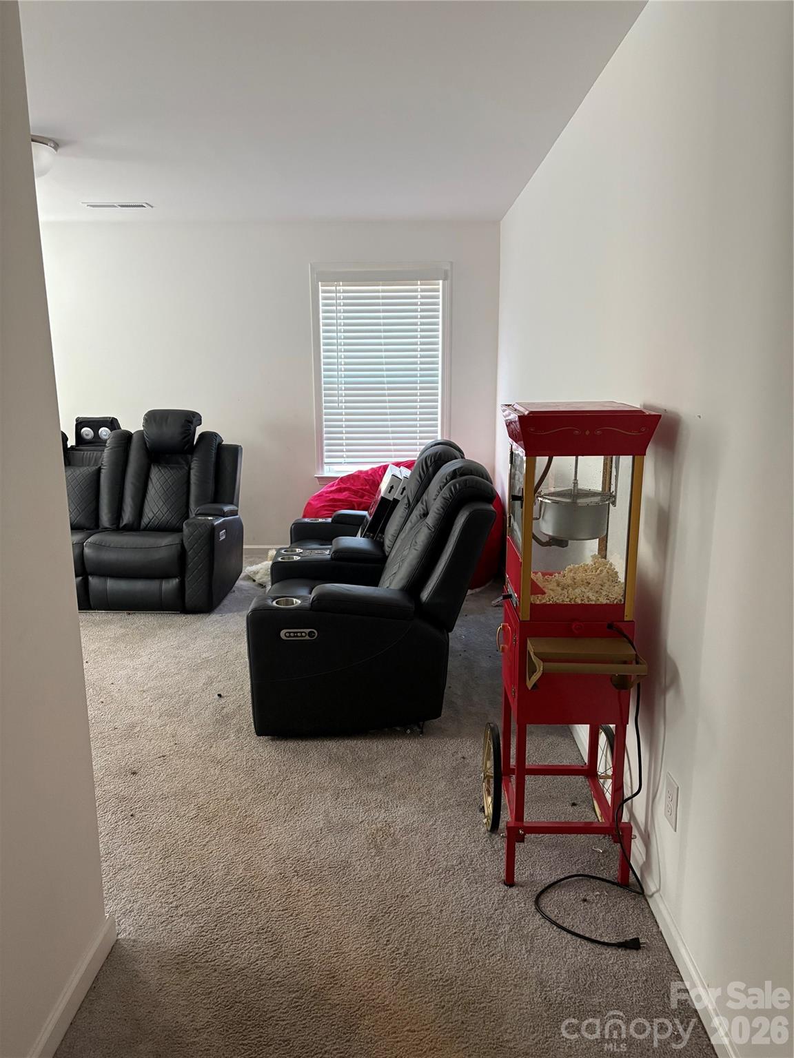 195 Batten Rdg Drive Statesville, NC 28677 - Photo 23 of 34 a living room with furniture a lamp and a window