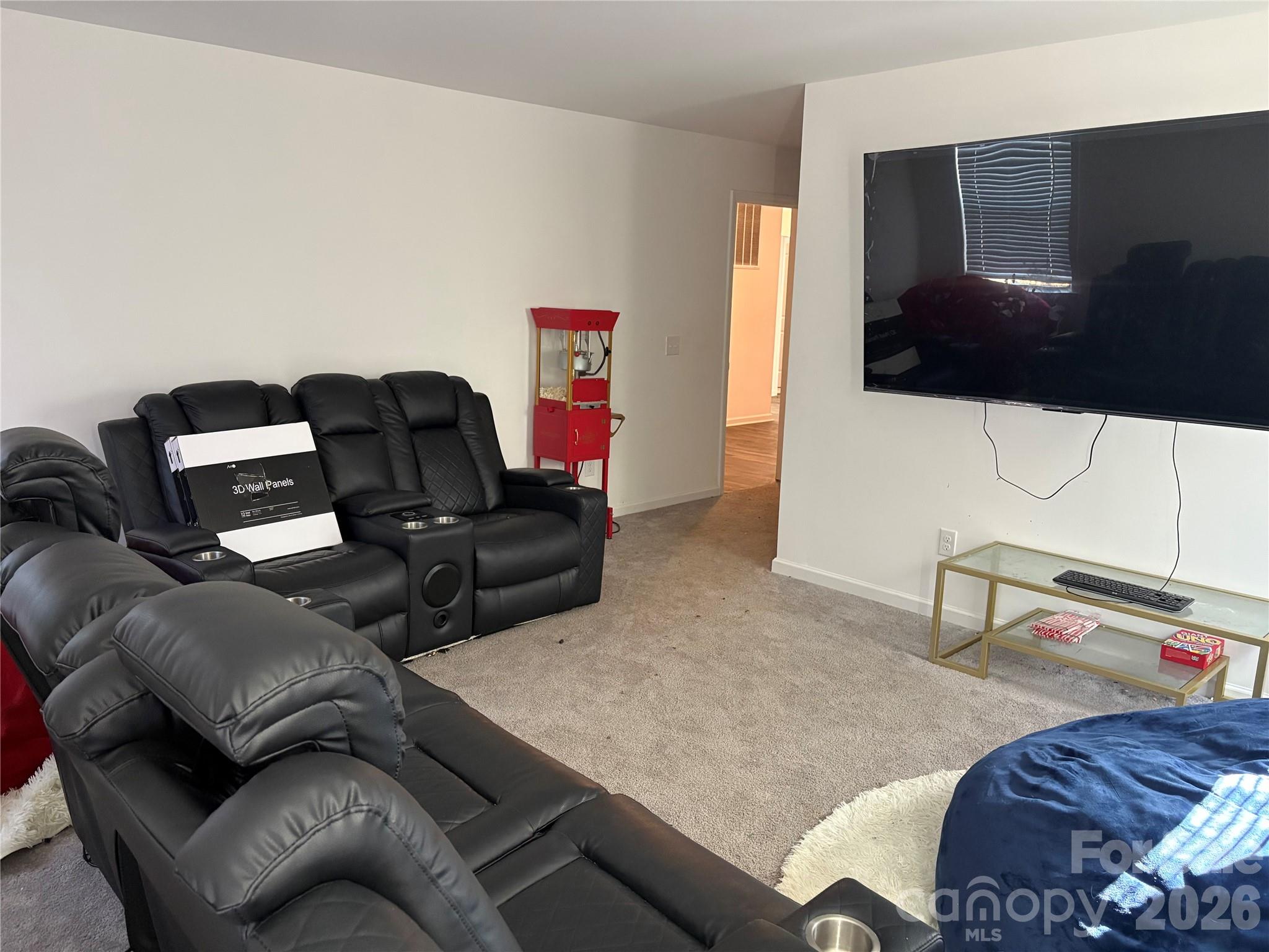 195 Batten Rdg Drive Statesville, NC 28677 - Photo 25 of 34 a living room with furniture and a flat screen tv