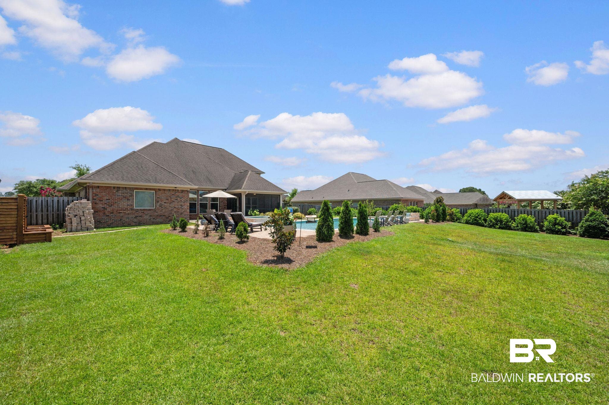 409 Fortune Drive Fairhope, AL 36532 - Photo 42 of 42 Spacious backyard with a large inground swimming pool and surrounding patio