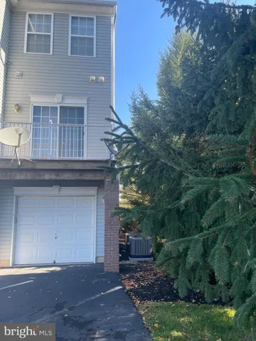 a front view of a house with a garage