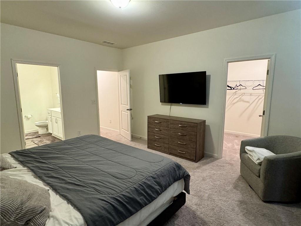 152 Andria Way Northwest Cartersville, GA 30120 - Photo 23 of 24 a bedroom with a bed and a flat screen tv