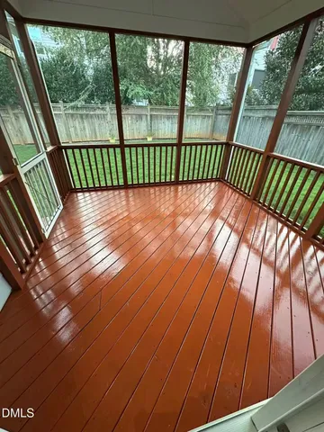 a view of balcony with wooden floor