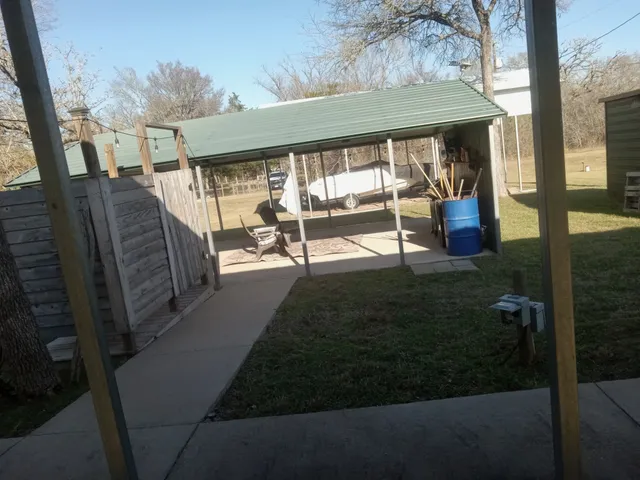 a view of a porch with furniture and floor to ceiling window