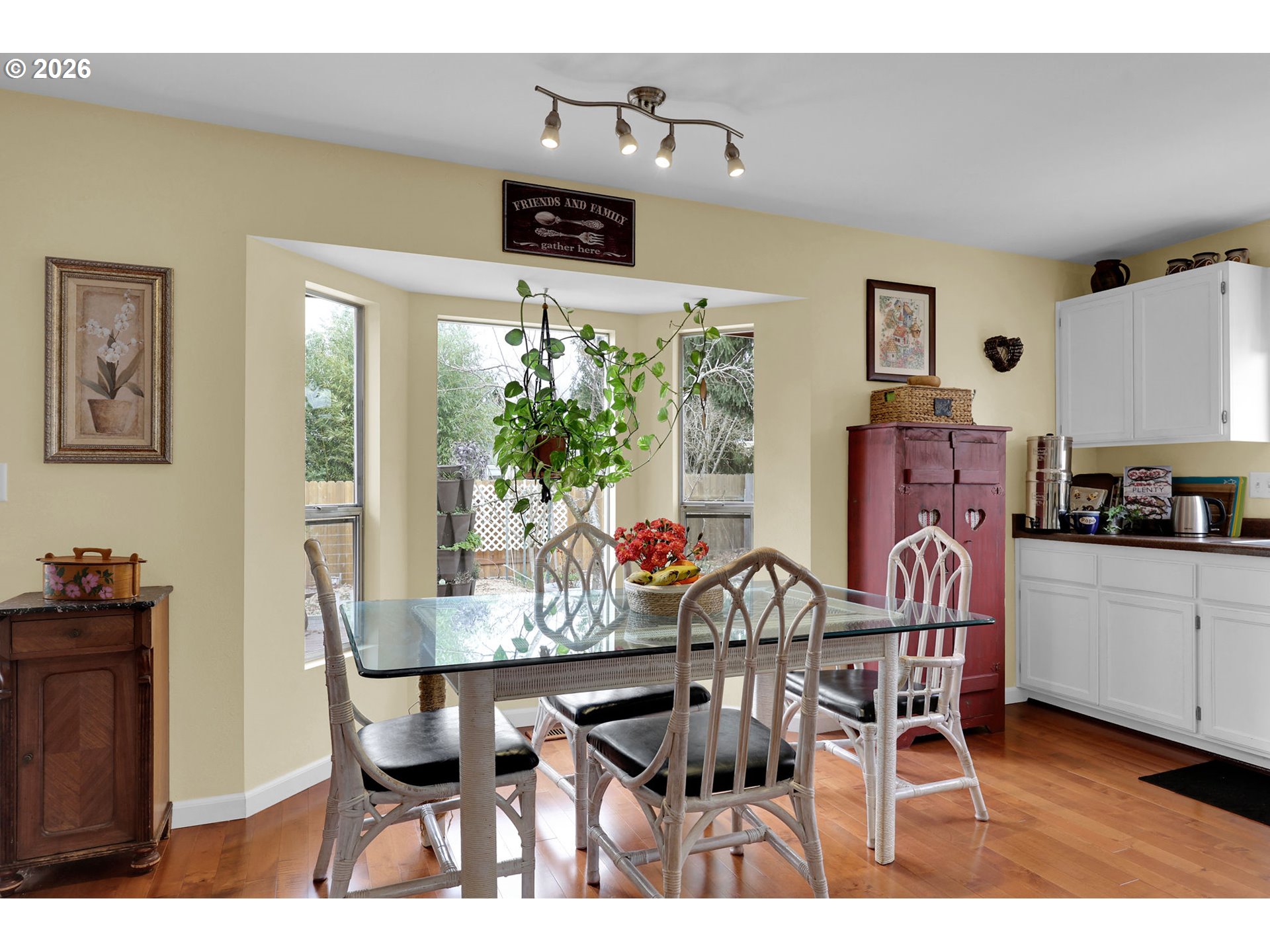 4452 Jessica Drive Springfield, OR 97478 - Photo 14 of 43 a view of a dining room with furniture and a potted plant