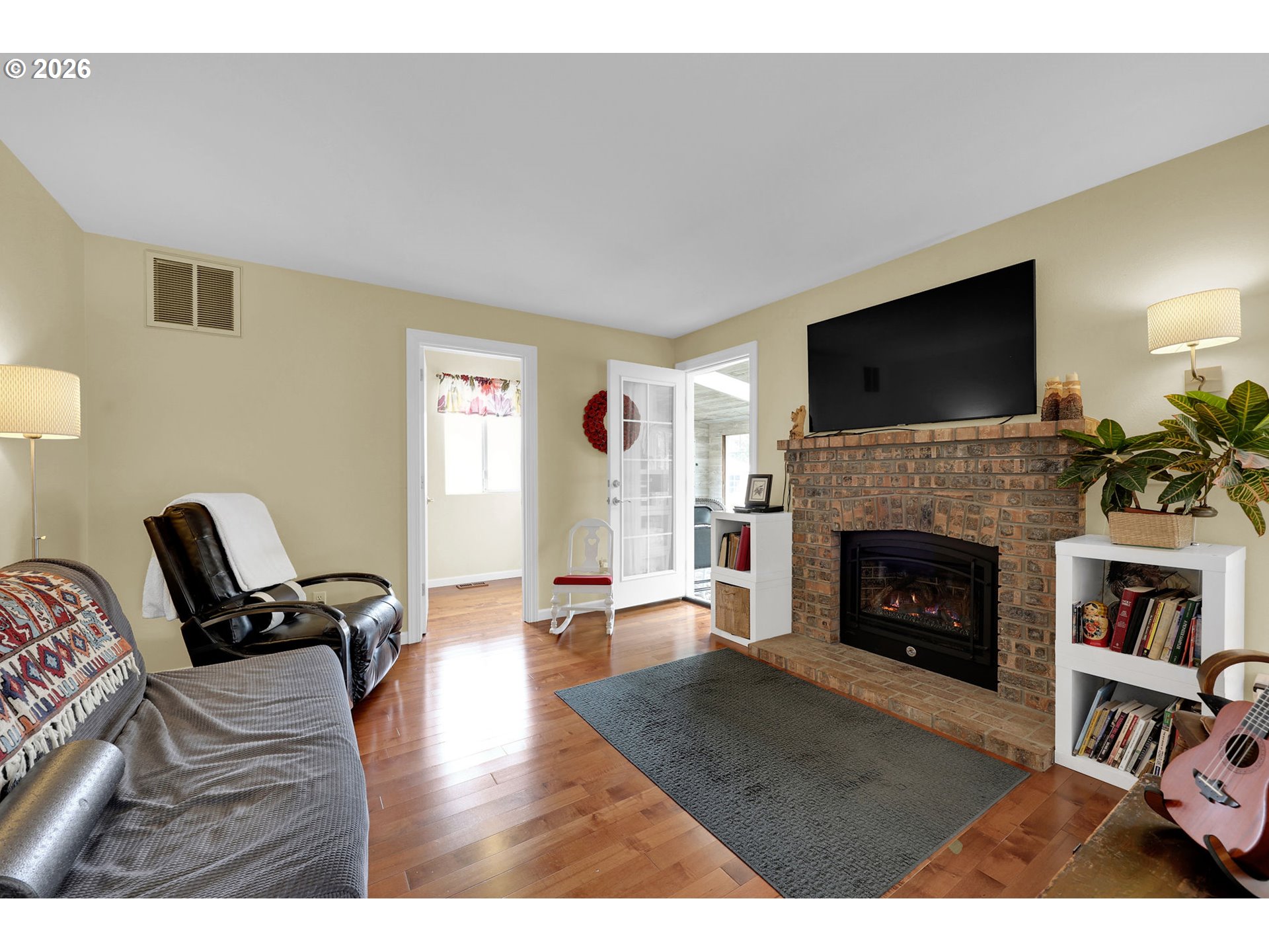 4452 Jessica Drive Springfield, OR 97478 - Photo 17 of 43 a living room with furniture fireplace and flat screen tv