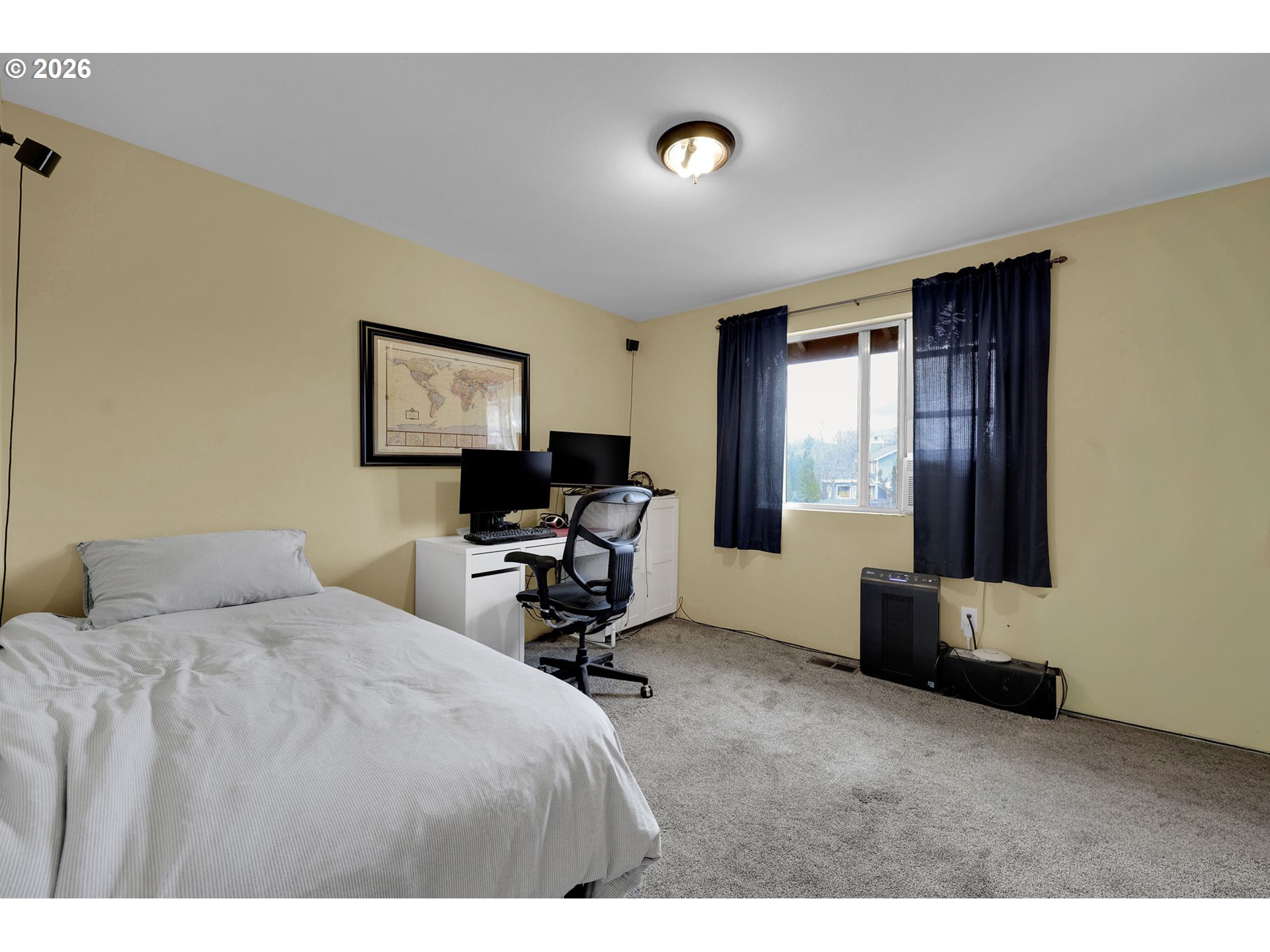 4452 Jessica Drive Springfield, OR 97478 - Photo 29 of 43 a bedroom with a bed a chair and a large window