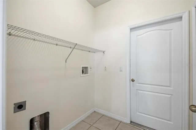 a large white kitchen with cabinets and white appliances