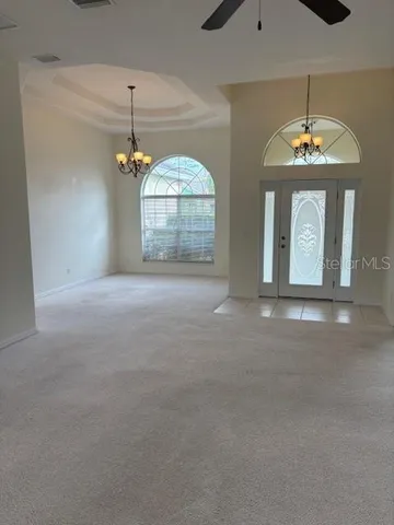 a view of a room with ceiling fan