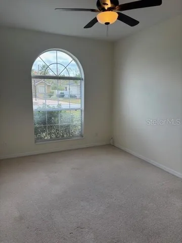 a large bathroom with a bathtub and a sink